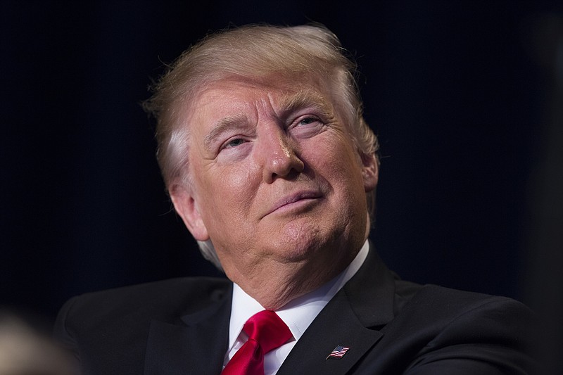 
              President Donald Trump listens as he is introduced during the National Prayer Breakfast, Thursday, Feb. 2, 2017, in Washington. (AP Photo/Evan Vucci)
            