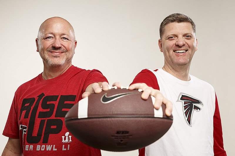 Sports editor Stephen Hargis, right, and sports writer Lindsey Young, both lifelong Falcons fans, are ready for tonight's Super Bowl against the New England Patriots.