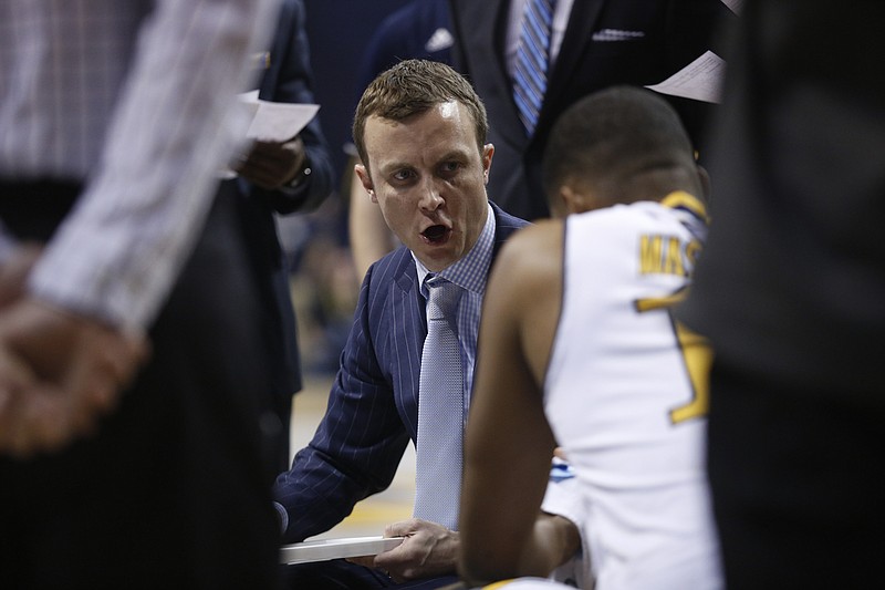 UTC men's basketball coach Matt McCall talks to players in a timeout during the Mocs' home basketball game against the Western Carolina Catamounts at McKenzie Arena on Saturday, Feb. 4, 2017, in Chattanooga, Tenn.