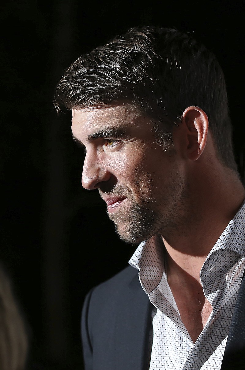
              Michael Phelps listens to a reporter's question on the red carpet for the Big Game Big Give event in Houston on Saturday, Feb. 5, 2017. Phelps hosted for the celebrity poker tournament. (AP Photo/John Carucci)
            