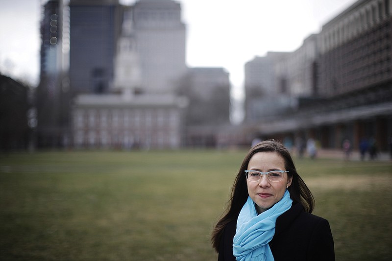 
              Rhea Powell poses for a photograph in view of Independence Hall in Philadelphia, Thursday, Feb. 2, 2017. The massive turnout for last month's women's marches protesting the policies of the Trump administration have led to calls for sustained political activism to help Democrats get back in power. (AP Photo/Matt Rourke)
            