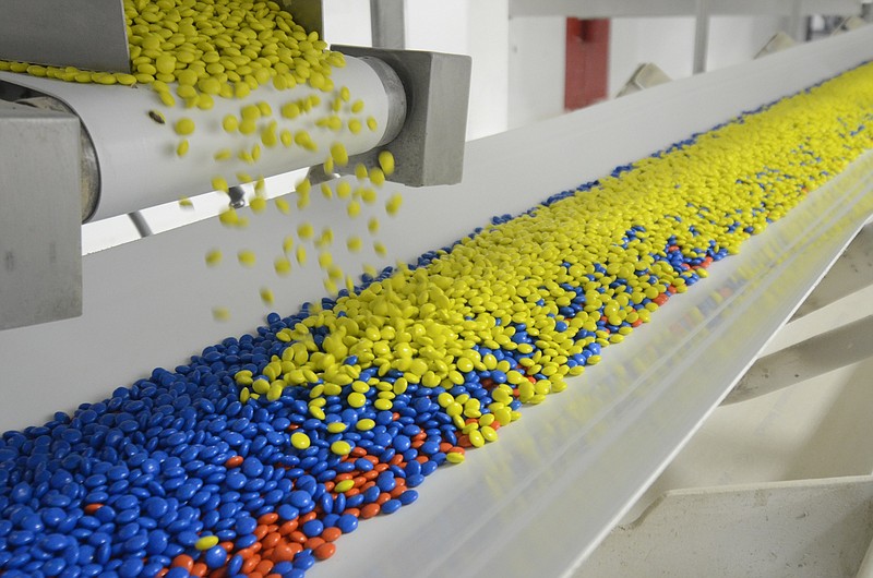 Apr 15, 2013-- M&M's spill onto a conveyor belt at the Mars Inc. plant in Cleveland.