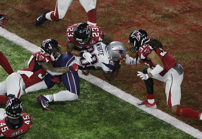 
              New England Patriots' James White scores the winning touchdown during overtime of the NFL Super Bowl 51 football game against the Atlanta Falcons, Sunday, Feb. 5, 2017, in Houston. (AP Photo/Charlie Riedel)
            