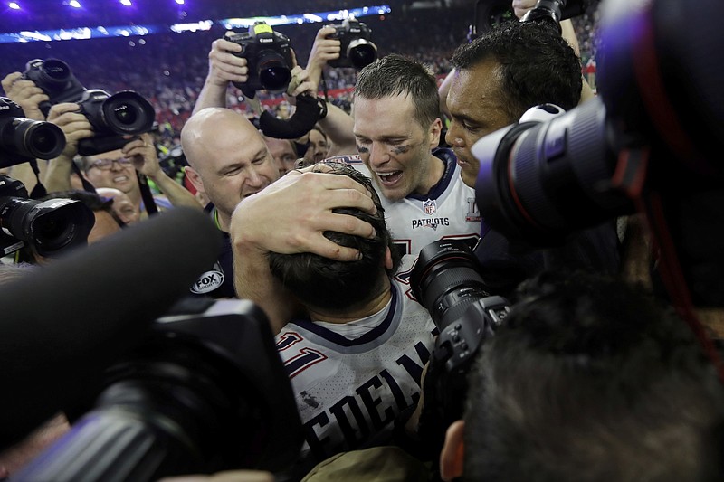 
              New England Patriots' Tom Brady celebrates with teammate Julian Edelman after the team defeated the Atlanta Falcons in overtime at the NFL Super Bowl 51 football game Sunday, Feb. 5, 2017, in Houston. The Patriots defeated the Falcons 34-28. (AP Photo/Darron Cummings)
            