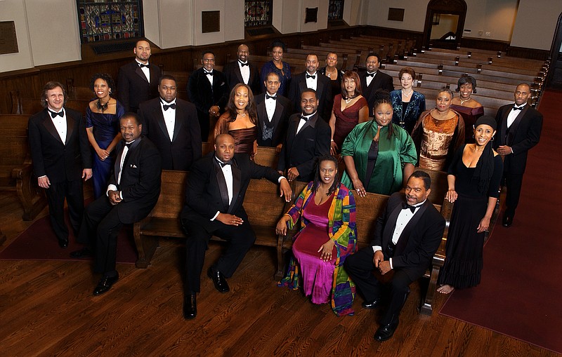 The American Spiritual Ensemble features 24 professional singers. Director and founder Dr. Everett McCorvey is seated left.