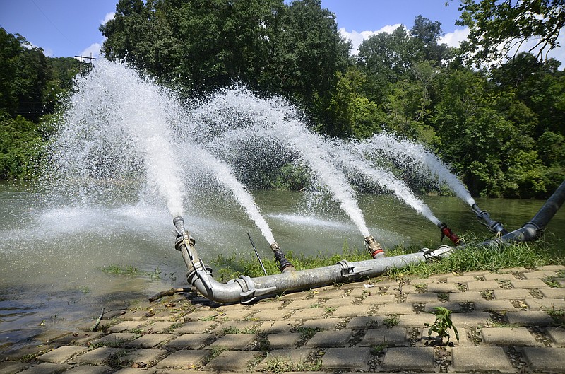 In this file photo, workers from Marion Environmental Inc. and the Chattanooga Public Works Department aerate polluted water on the South Chickamauga Creek in 2014.