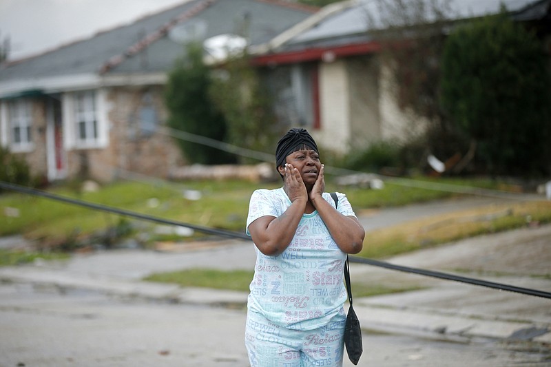 
              Lisa Carruth reacts as she surveys the damage after a tornado tore through the eastern part of New Orleans, Tuesday, Feb. 7, 2017.   The National Weather Service says at least three confirmed tornadoes have touched down, including one inside the New Orleans city limits. Buildings have been damaged and power lines are down. (AP Photo/Gerald Herbert)
            