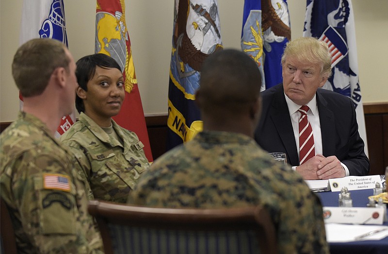 President Donald Trump has lunch with troops while visiting U.S. Central Command and U.S. Special Operations Command at MacDill Air Force Base, Fla., Monday, Feb. 6, 2017. Trump, who spent the weekend at Mar-a-Lago, stopped for a visit to the headquarters before returning to Washington. (AP Photo/Susan Walsh)