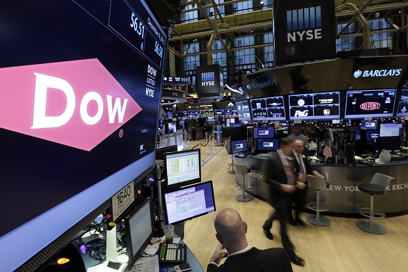 
              FILE - In this Dec. 9, 2015, file photo, the company names of Dow, left, and Dupont, right, appear above their trading posts on the floor of the New York Stock Exchange. Dow Chemical and DuPont propose selling some businesses in order to get approval from European Commission for their merger. The companies still expect their merger to close during the first half of 2017. (AP Photo/Richard Drew, File)
            