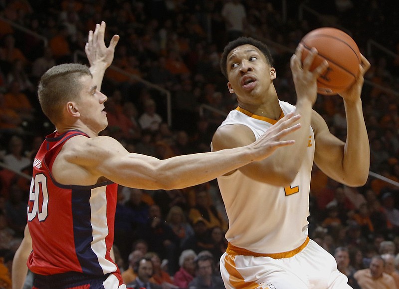 Tennessee's Grant Williams tries to set up a shot while being guarded by Justas Furmanavicius of Ole Miss on Wednesday night at Thompson-Boling Arena in Knoxville.