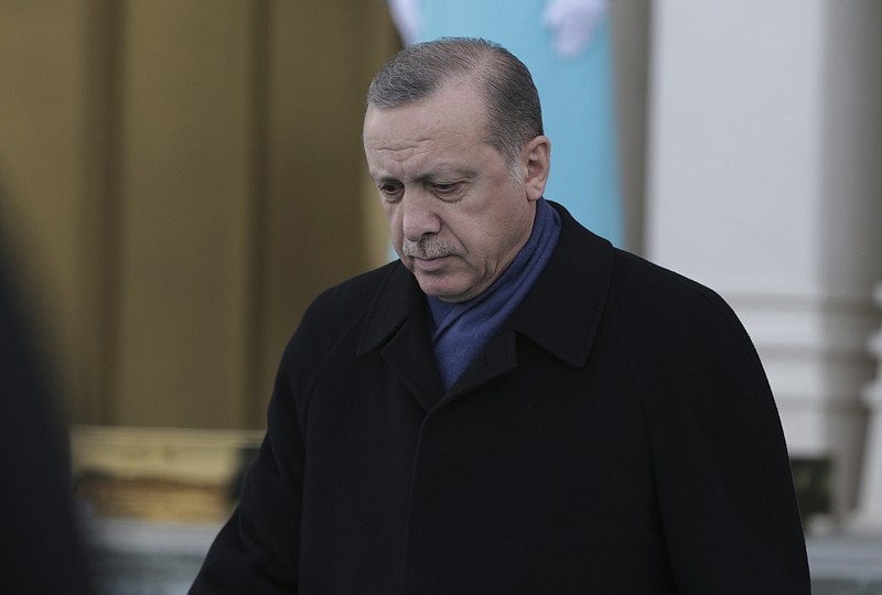 
              Turkey's President Recep Tayyip Erdogan, walks to greet Ethiopia's President Mulatu Teshome Wirtu, at the Presidential Palace, in Ankara Tuesday, Feb. 7, 2017.(AP Photo/Burhan Ozbilici)
            