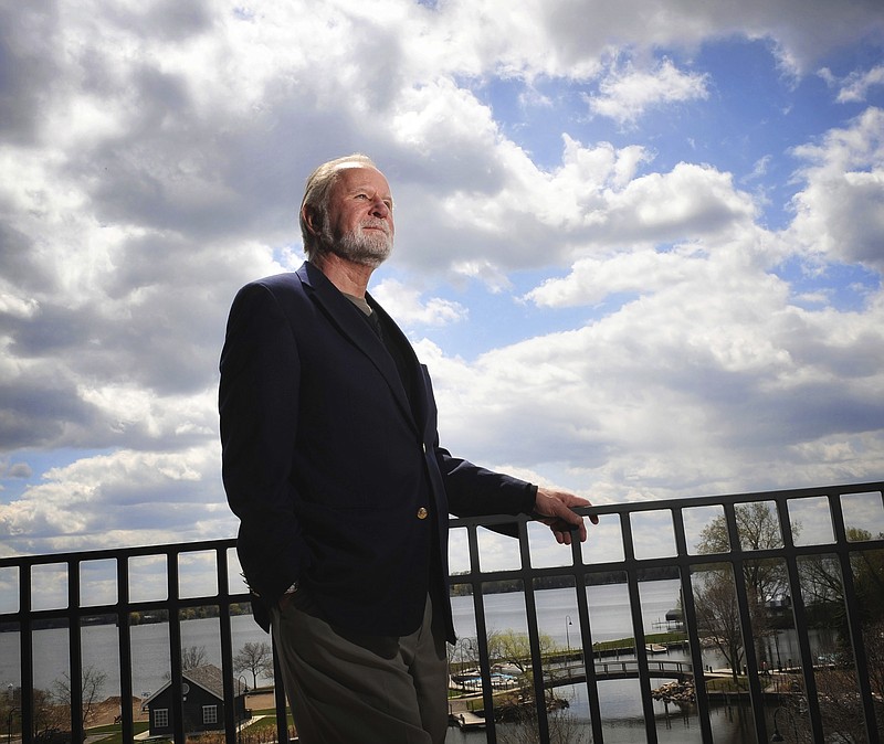 
              This Friday, May 1, 2009 photo shows Bill Cooper, CEO of TCF Financial Corp., at his company's corporate headquarters in Wayzata, Minn., overlooking Wayzata Bay. Cooper, credited with reviving and building the once failing savings and loan into Minnesota's third-largest banking company, has died at age 73. (Glen Stubbe/Star Tribune via AP)
            