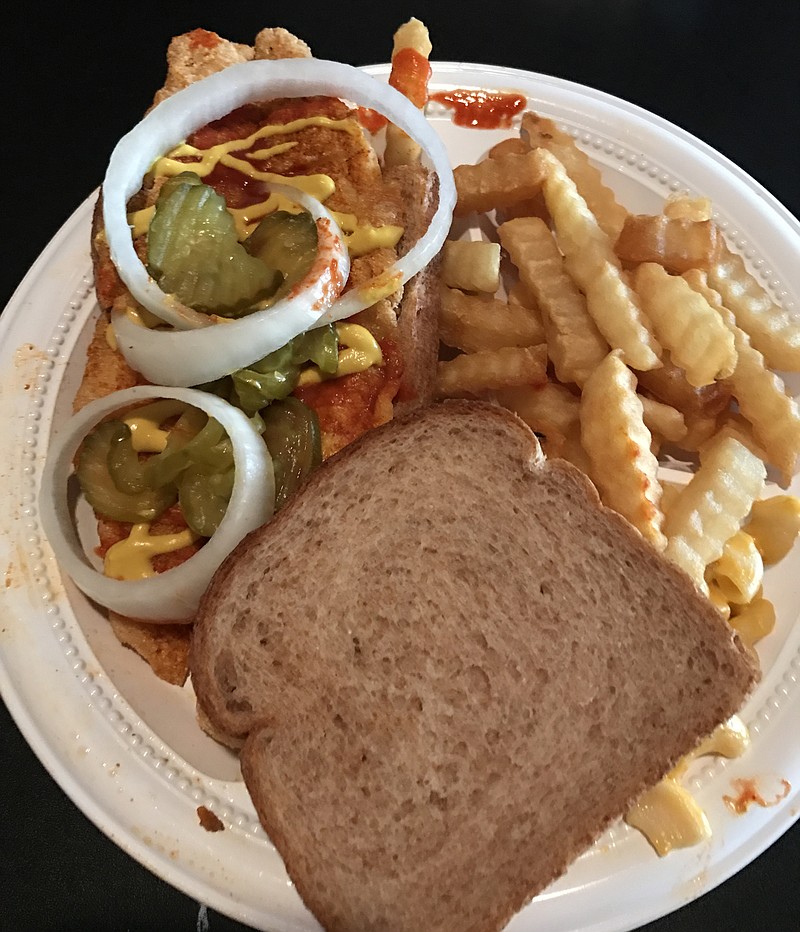 My extra spicy catfish plate at Bolton's came with two slices of wheat bread, onion slices, pickles, fries and mac and cheese. It's a spicy, crunchy, delicious piece of fish.