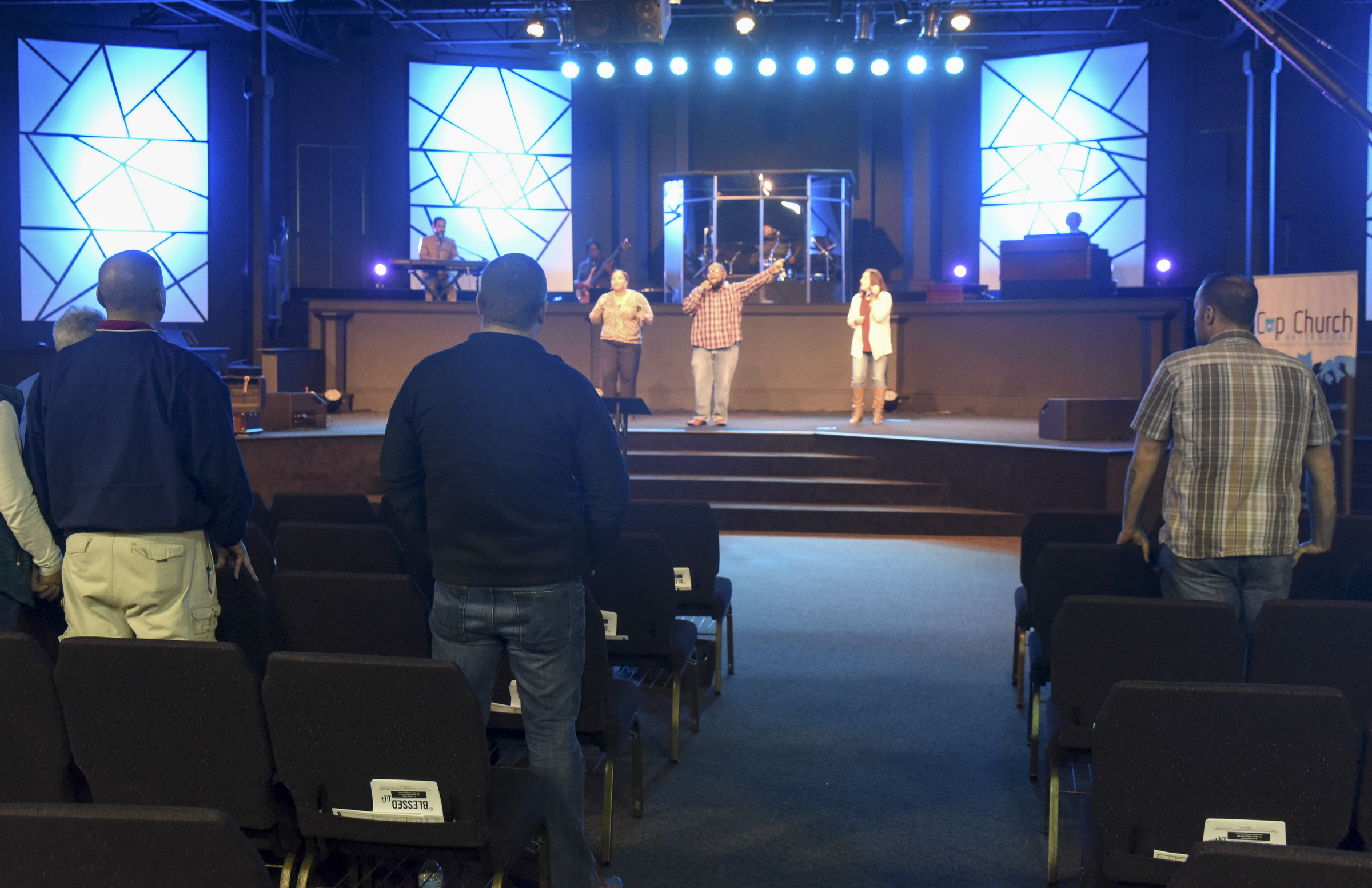 Devon Goins, center stage, leads congregational singing with the Metro Tabernacle Praise Band.
