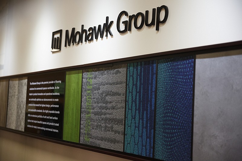 Samples are displayed on the wall at Mohawk Flooring Center on Thursday, Nov. 12, 2015, in Calhoun, Ga. Mohawk cut the ribbon Thursday on its new LEED gold-certified building at its Calhoun campus.