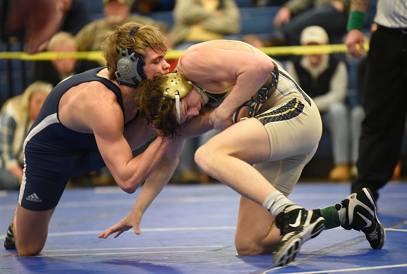 Bradley Central's Knox Fuller, right, controls Soddy-Daisy's Emory Holcomb on his way to a 8-1 decision in the 130-pound class during Saturday's Region 4-AAA wrestling tournament at Cleveland Middle School.