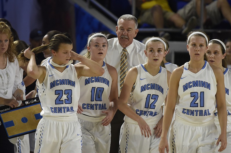 McMinn Central girls' basketball coach Johnny Morgan, shown with his team during a state-tournament game last March, recently earned the 900th coaching victory in his 39-year career.