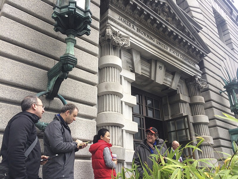 
              Members of the media line outside the 9th U.S. Circuit Court of Appeals building in San Francisco on Thursday, Feb. 9, 2017. A federal appeals court refused Thursday to reinstate President Donald Trump's ban on travelers from seven predominantly Muslim nations, dealing another legal setback to the new administration's immigration policy. (AP Photo/Haven Daley)
            