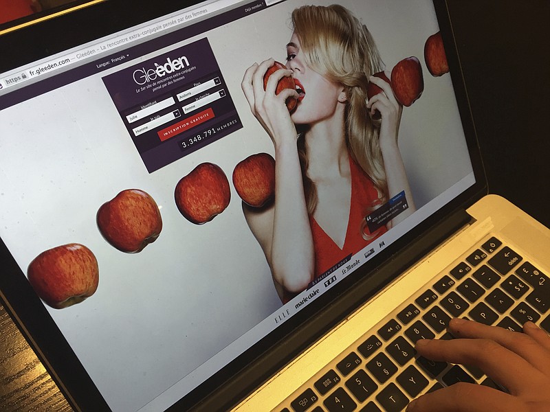 
              The Gleeden web site is displayed on a computer screen in Paris, France, Thursday, Feb. 9, 2017. A French court has thrown out a complaint by a federation of Catholic families that dating site Gleeden's business model is illegal and anti-social because it encourages extramarital affairs. (AP Photo/Laurent Rebours)
            