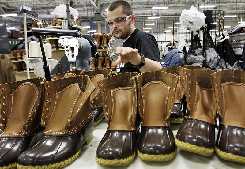 
              FILE - In this Dec. 14, 2011, file photo, Eric Rego stitches boots in the facility where LL Bean boots are assembled in Brunswick, Maine. L.L. Bean will freeze its pensions and offer an early retirement program in 2018 as it seeks to control growing expenses. Steve Smith, the Maine-based retailer's CEO, is making the announcement in a memo and in meetings with workers on Thursday, Feb. 9, 2017. (AP Photo/Pat Wellenbach, File)
            