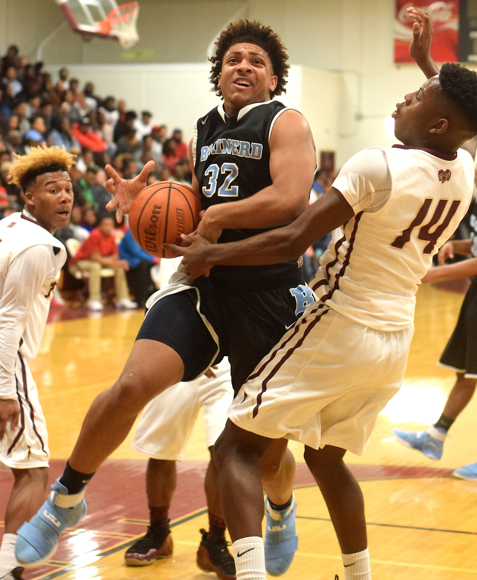Brainerd's Jessie Walker, left, and Tyner's Jaylen Bowens struggle for the basketball during Friday night's District 6-AA game at Tyner. The host Rams lost 59-54 in double overtime but learned after the game they were regular-season district champs via a tiebreaker.