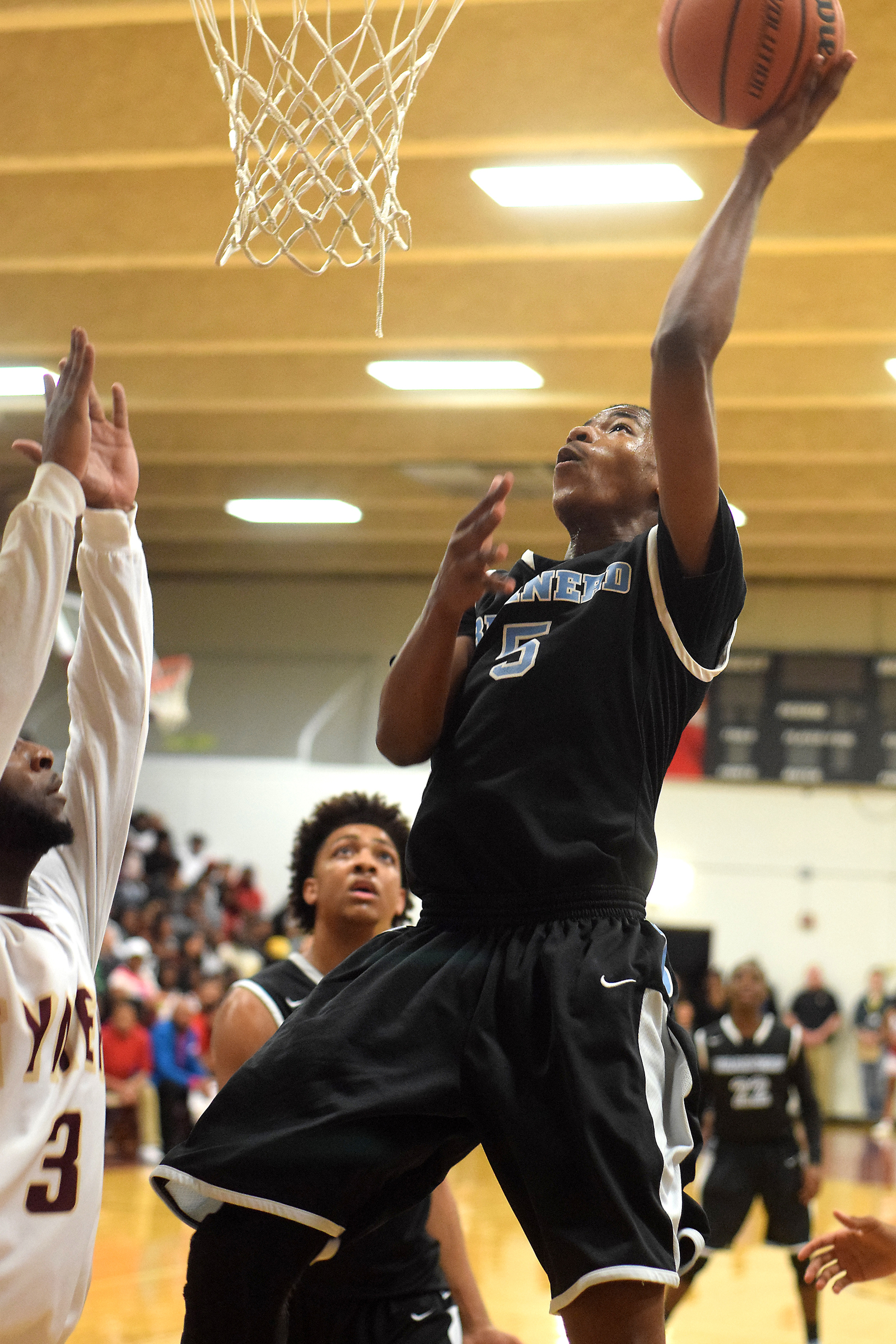 Brainerd's Keyshawn Bradley (5) puts up a shot under the basket. The Brainerd Panthers visited the Tyner Rams in TSSAA basketball action on February 10, 2017.