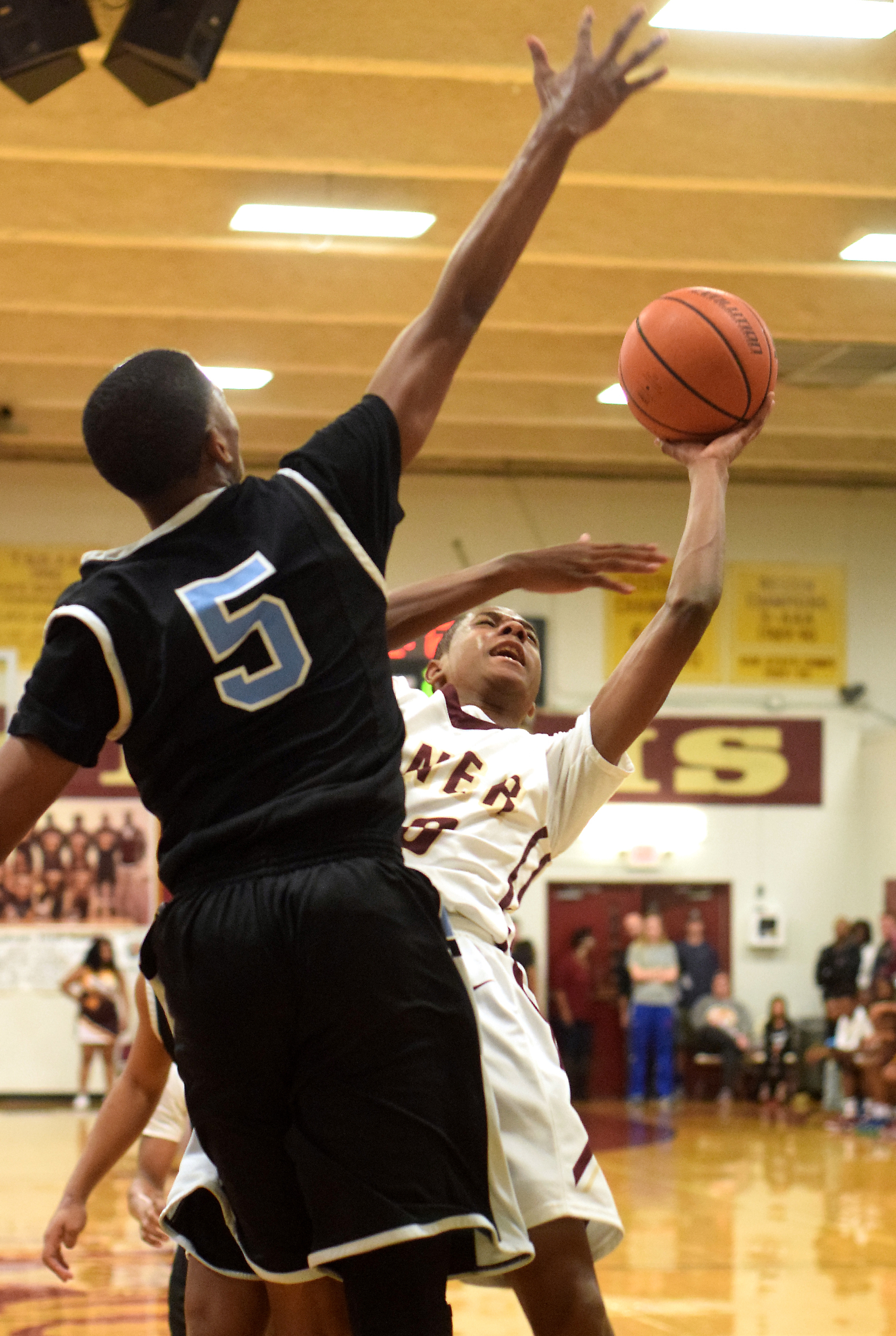 Tyner's Jaden Mynatt (40) takes a shot under the defensive pressure of Brainerd's Keyshawn Bradley (5). The Brainerd Panthers visited the Tyner Rams in TSSAA basketball action on February 10, 2017.