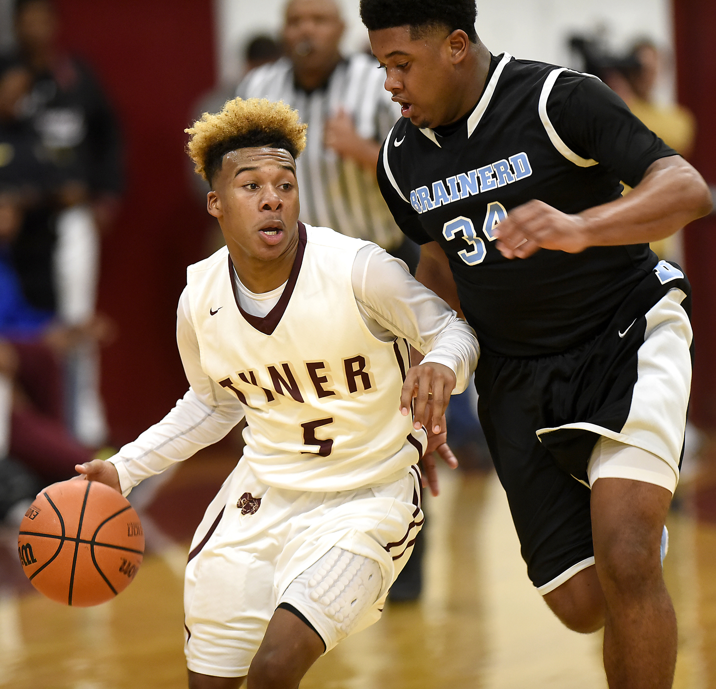 Tyner's KeMarkus Young (5) dribbles inside Brainerd's Jamaul Herman (34). The Brainerd Panthers visited the Tyner Rams in TSSAA basketball action on February 10, 2017.
