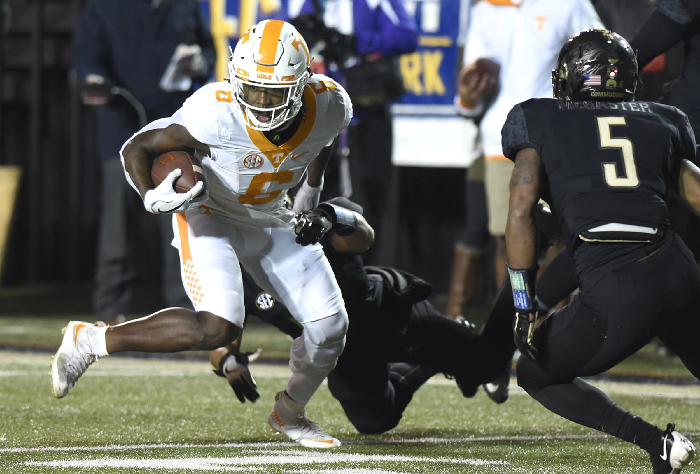 Tennessee's Alvin Kamara (6) slips the tackle of Vanderbilt's Zach Cunningham (41) on the way to a Volunteer touchdown. It was Kamara's second td of the half. The Tennessee Volunteers visited the Vanderbilt Commodores in a cross-state rivalry at Dudley Stadium on November 26, 2016.