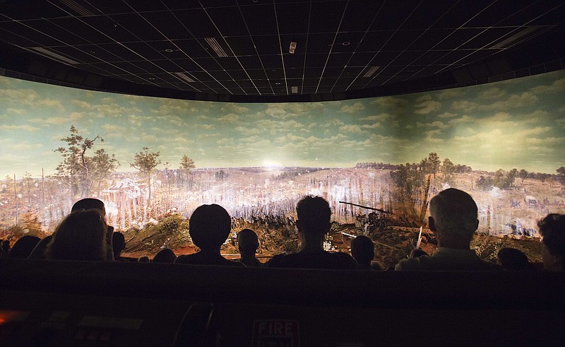 
              FILE - In this Tuesday, June 30, 2015, file photo, visitors view the Atlanta Cyclorama, the colossal Civil War painting in Atlanta. The painting depicting the Battle of Atlanta from the American Civil War will soon be moved from the building where it has been displayed for nearly a century. Historians said moving the 6-ton Cyclorama, one of the nation's largest paintings, from Grant Park to the Atlanta History Center across town marks a major milestone in its restoration. The move is to begin Thursday, Feb. 9, 2017. (AP Photo/David Goldman, File)
            