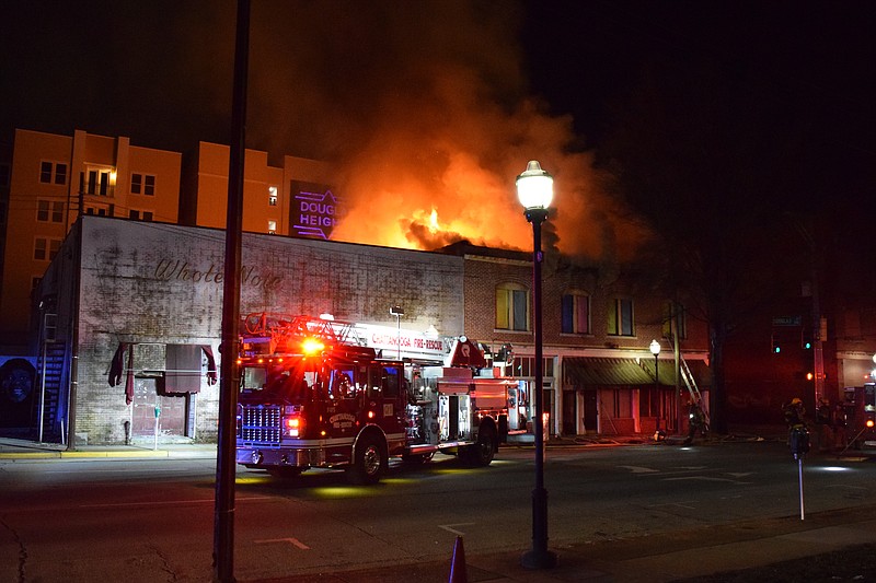 Photo by Mark Pace /Times Free Press 1/10/17. A large fire burns a commercial building next to Douglas Heights Apartments on the corner of Douglas Street and East M.L. King Blvd. early Feb. 10.