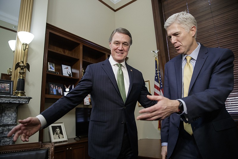 
              Supreme Court Justice nominee Neil Gorsuch, right, meets with Sen. David Perdue, R-Ga. on Capitol Hill in Washington, Friday, Feb. 10, 2017. (AP Photo/J. Scott Applewhite)
            