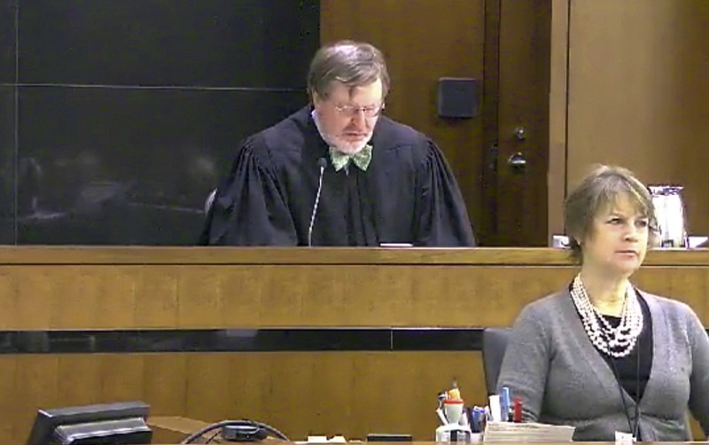 
              FILE - This March 12, 2013 file still image taken from United States Courts shows Judge James Robart listening to a case at Seattle Courthouse in Seattle. Online abuse of Robart, who temporarily derailed President Donald Trump's travel ban, has raised safety concerns, according to experts who are worried that the president's attacks on the judiciary could make judges a more inviting target. (United States Courts via AP,File)
            