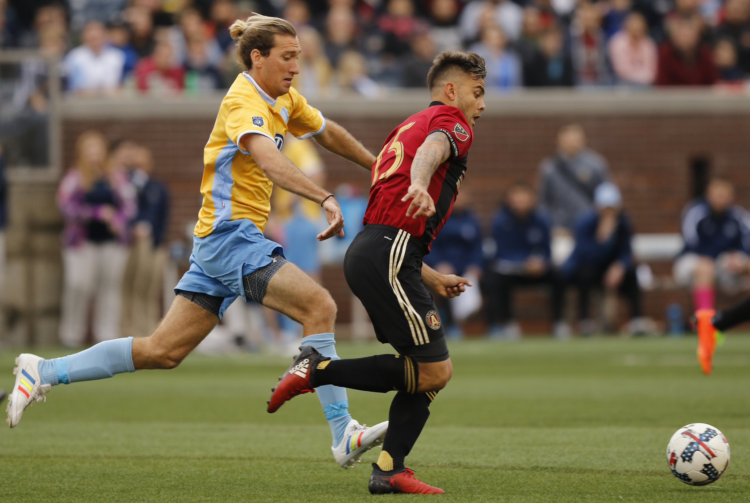 AUFC's Hector Villalba, right, takes the ball ahead of CFC's Juan Hernandez during Chattanooga FC's friendly match against Atlanta United FC at Finely Stadium on Saturday, Feb. 11, 2017, in Chattanooga, Tenn.