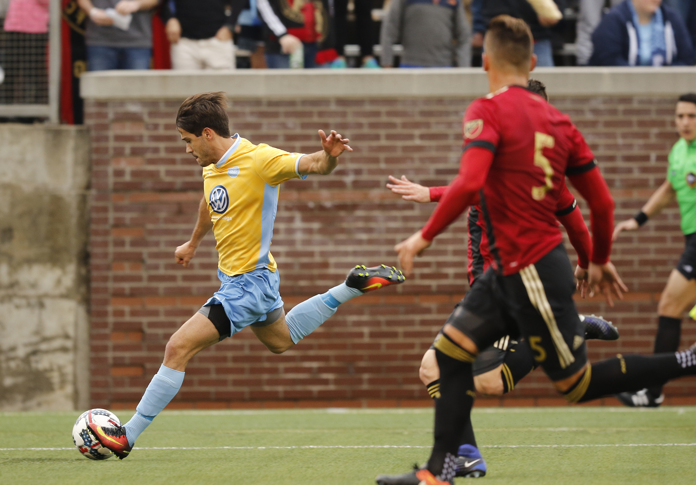 CFC's Zecca Ferraz, left, takes a shot around AUFC's Leandro Gonzalez Pirez during Chattanooga FC's friendly match against Atlanta United FC at Finely Stadium on Saturday, Feb. 11, 2017, in Chattanooga, Tenn.