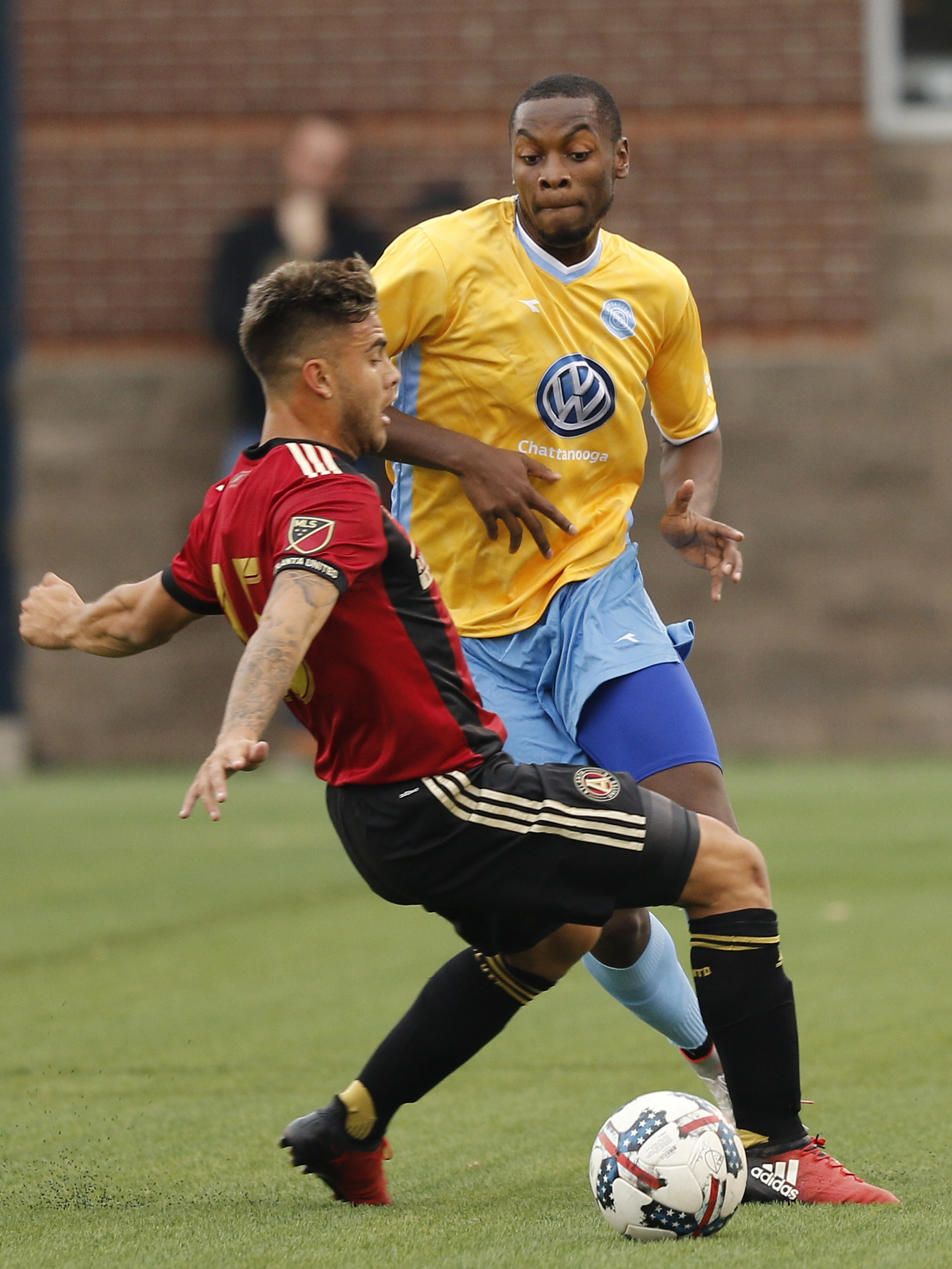 AUFC's Hector Villalba, left, collides with CFC's Jordan Dunstan during Chattanooga FC's friendly match against Atlanta United FC at Finely Stadium on Saturday, Feb. 11, 2017, in Chattanooga, Tenn.