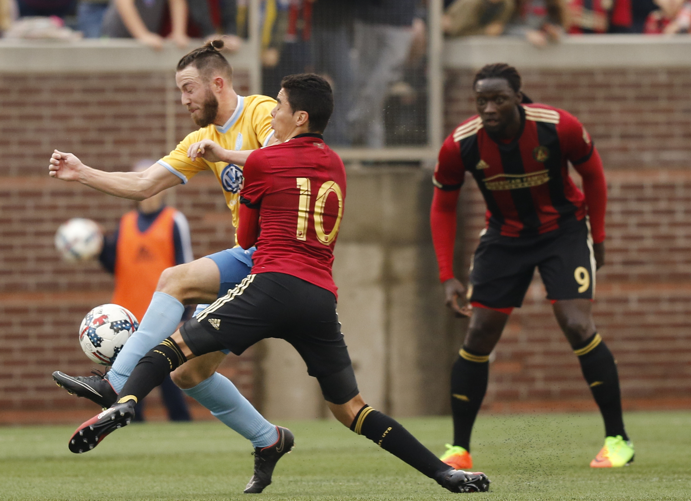 CFC's Matt Aldred, left, collides with AUFC's Miguel Almiron, resulting in a yellow card for Aldred during Chattanooga FC's friendly match against Atlanta United FC at Finely Stadium on Saturday, Feb. 11, 2017, in Chattanooga, Tenn.