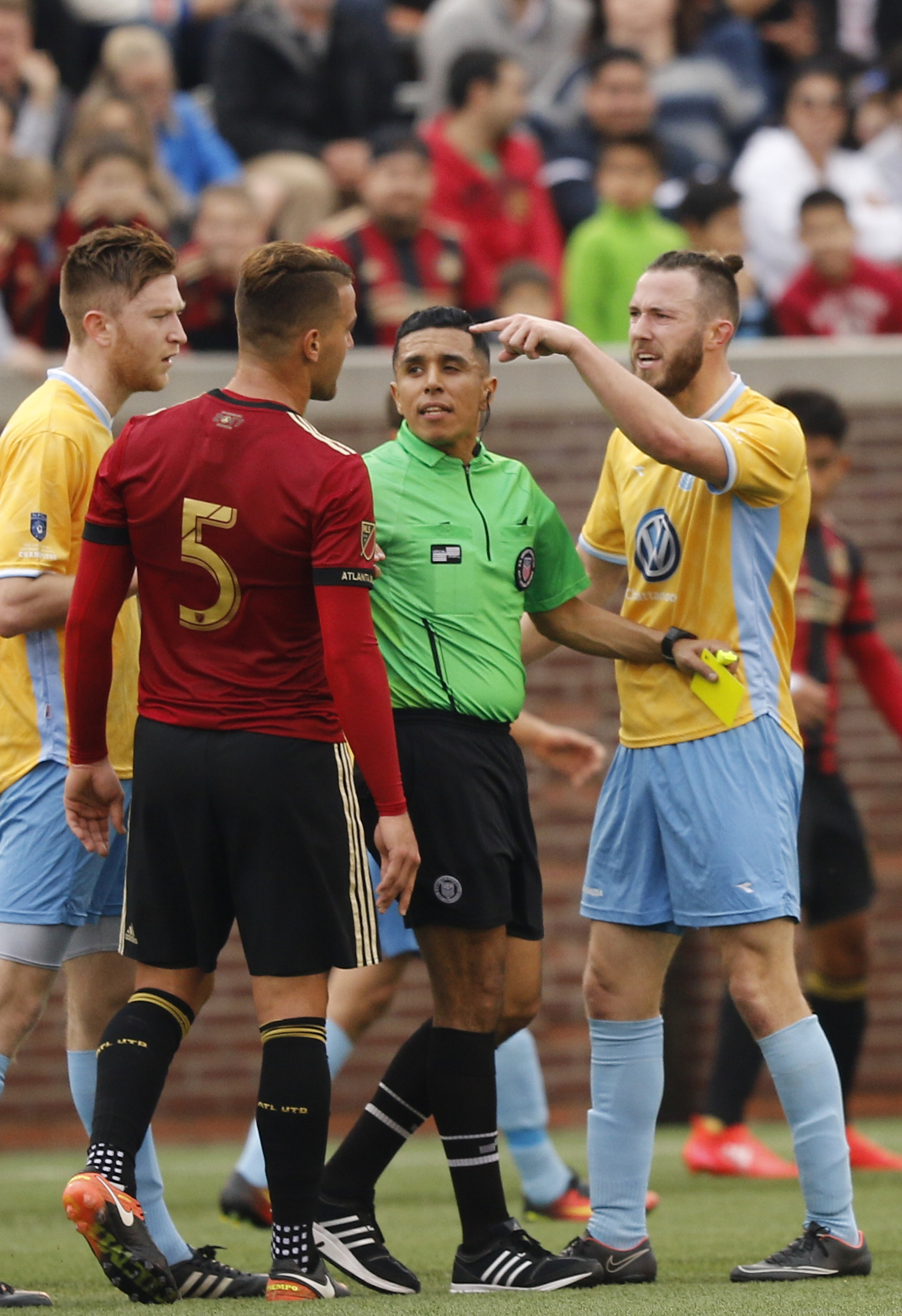 CFC's Matt Aldred, right, has to be separated from AUFC's Leandro Gonzalez Pirez after Aldred was yellow carded during Chattanooga FC's friendly match against Atlanta United FC at Finely Stadium on Saturday, Feb. 11, 2017, in Chattanooga, Tenn.