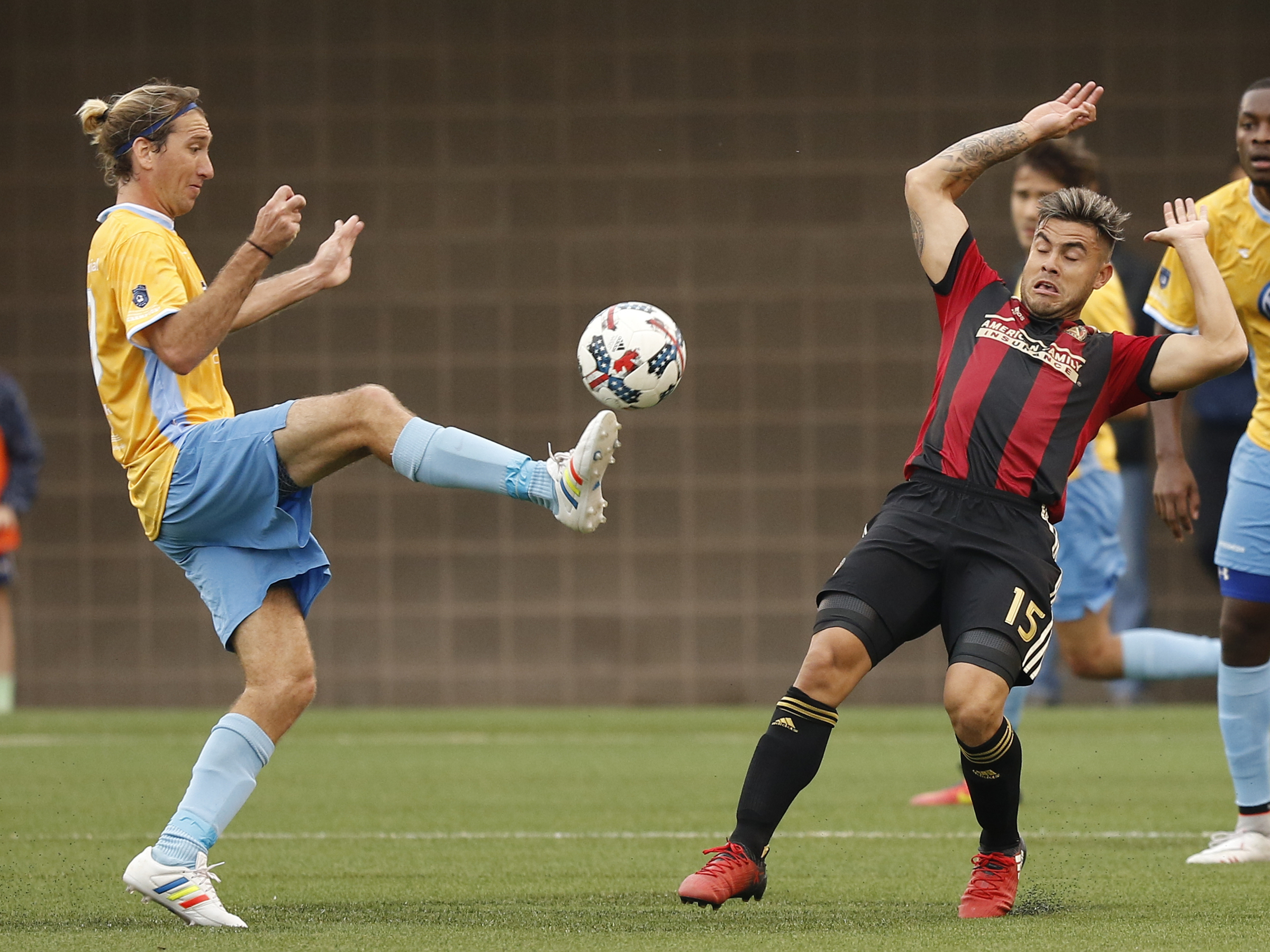 CFC's Juan Hernandez, left, kicks towards AUFC's Hector Villalba during Chattanooga FC's friendly match against Atlanta United FC at Finely Stadium on Saturday, Feb. 11, 2017, in Chattanooga, Tenn.