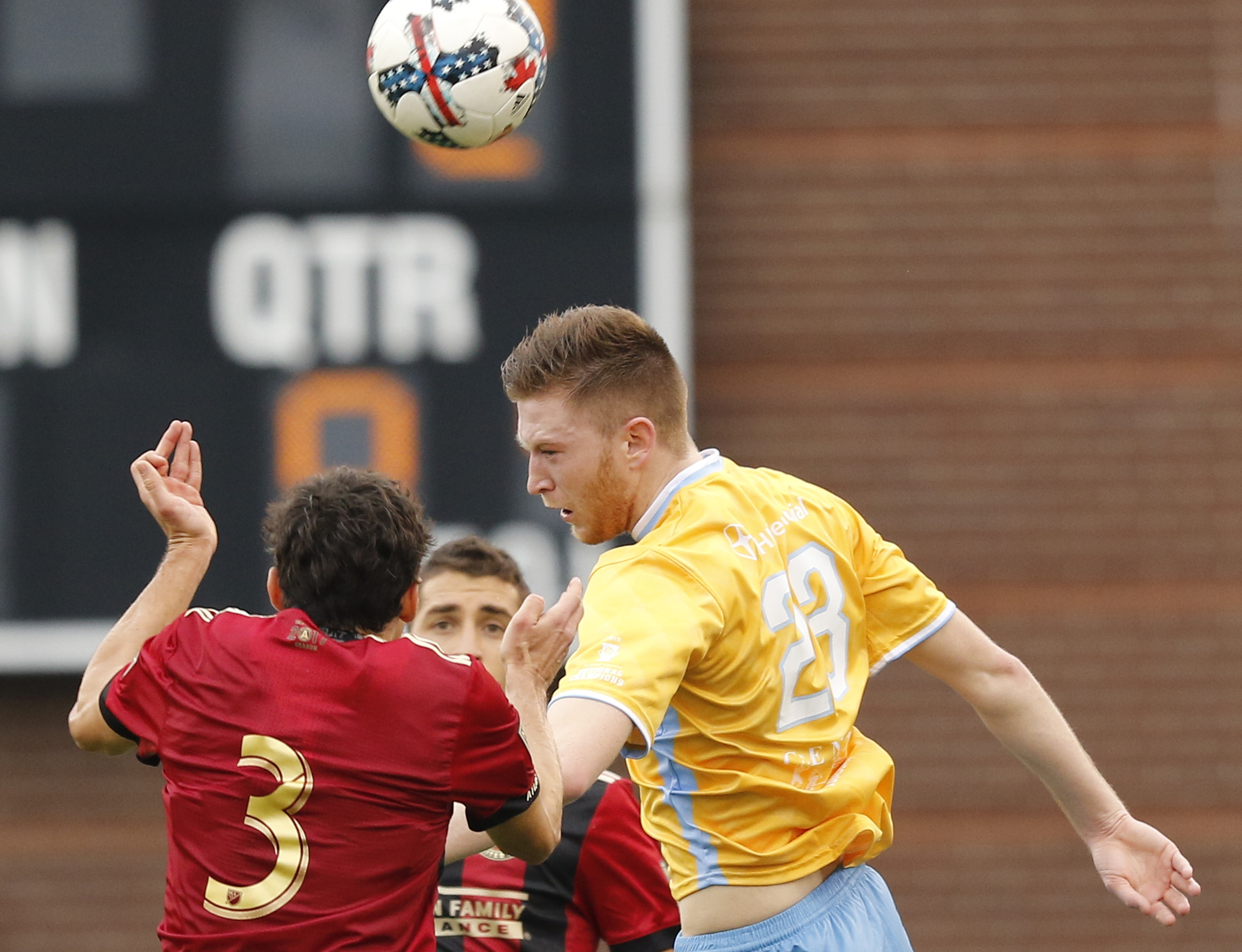 CFC's Danny Whitehall, right, heads the ball against AUFC's Michael Parkhurst during Chattanooga FC's friendly match against Atlanta United FC at Finely Stadium on Saturday, Feb. 11, 2017, in Chattanooga, Tenn.