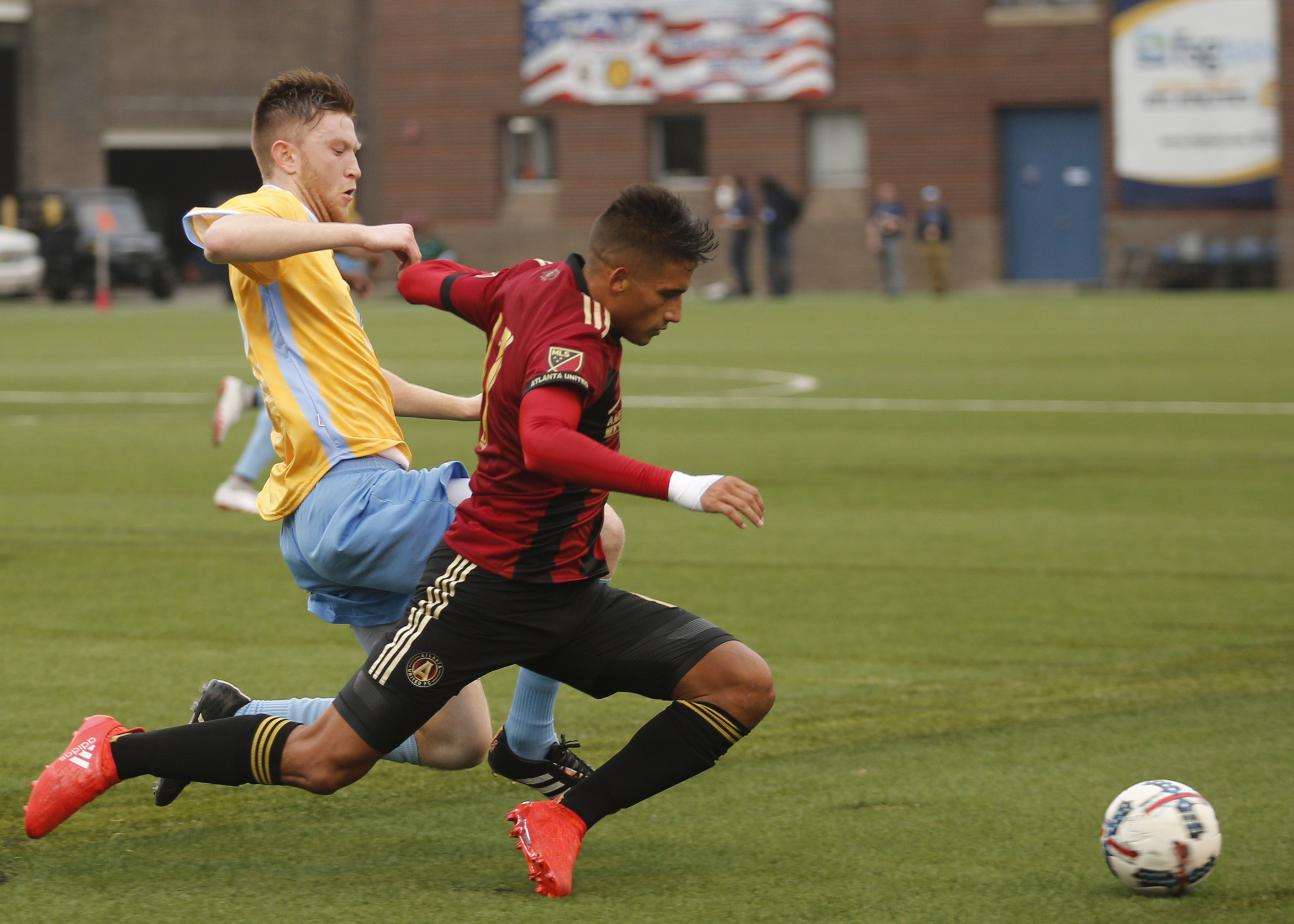 CFC's Danny Whitehall, left, tackles AUFC's Yamil Asad during Chattanooga FC's friendly match against Atlanta United FC at Finely Stadium on Saturday, Feb. 11, 2017, in Chattanooga, Tenn.