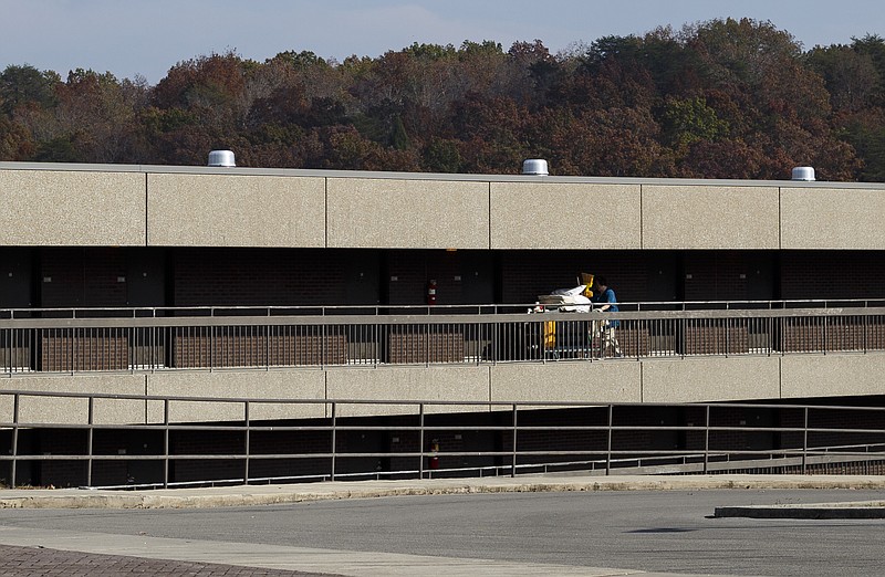 A housekeeper moves between rooms at the park inn at Fall Creek Falls State Park on Wednesday, Nov. 2, 2016, in Spencer, Tenn. A plan to demolish the park's existing inn and replace it with a new facility that is privately run has apparently been renewed, and the process would take more than 2 years which would displace the more than 60 current employees.