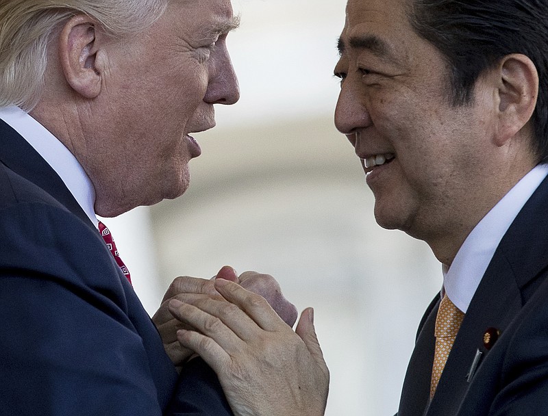 
              President Donald Trump welcomes Japanese Prime Minister Shinzo Abe outside the West Wing of the White House in Washington, Friday, Feb. 10, 2017. (AP Photo/Andrew Harnik)
            