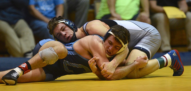 UTC's Justin Lampe and Citadel's Jason Carr compete in the 165 lb. weight class Sunday, Feb. 12, 2017 at UTC's Maclellan Gym.