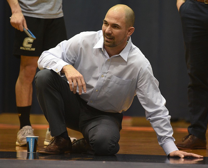 Heath Eslinger coaches during UTC's wrestling match against The Citadel on Sunday at Maclellan Gym.