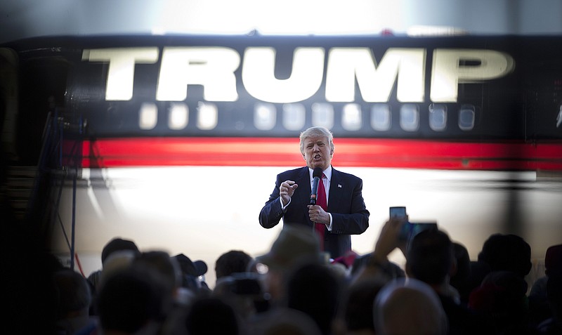 
              FILE - In this Feb. 27, 2016 file photo, then-Republican presidential candidate Donald Trump stands in front of his airplane as he speaks during a rally in Bentonville, Ark. No matter what issue Trump is addressing, he seems either to know somebody with a relevant personal experience or he’s got a firsthand tale to recount. (AP Photo/John Bazemore, File)
            