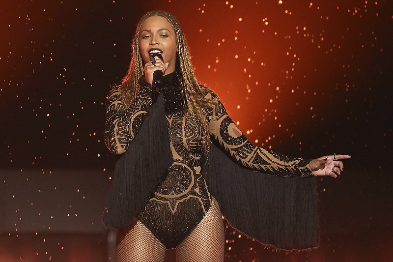 
              FILE - In this June 26, 2016, file photo, Beyonce performs "Freedom" at the BET Awards in Los Angeles. There are few things Beyonce has not conquered, and the Grammy for album of the year is one of them. Beyonce's main competition is Adele, who won album, song and record of the year in 2010 with "21" and "Rolling In the Deep." The 2017 Grammy Awards are held Sunday, Feb. 12, 2017. (Photo by Matt Sayles/Invision/AP, File)
            