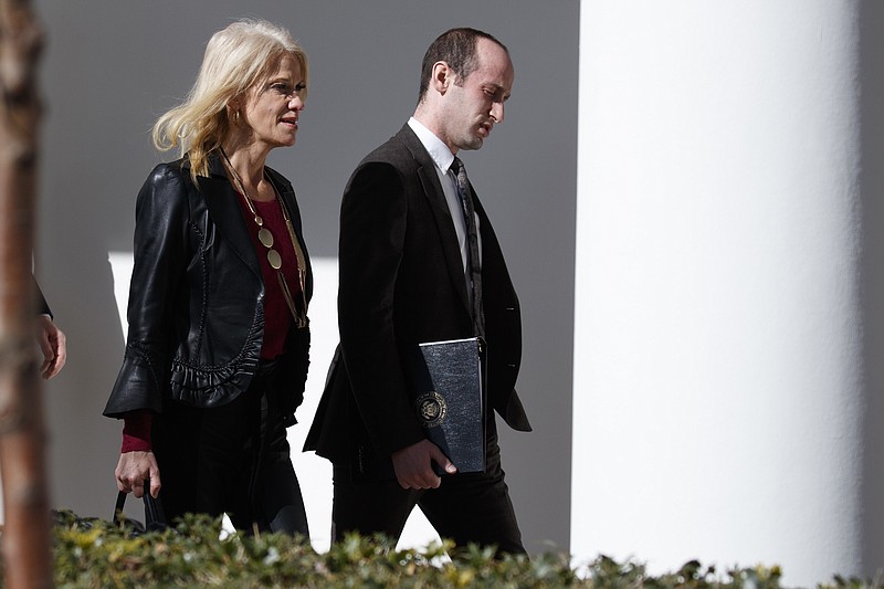 
              Kellyanne Conway, left, and Stephen Miller, both senior advisers to President Donald Trump, walk to a news conference with President Donald Trump and Japanese Prime Minister Shinzo Abe, Feb. 10, 2017, at the White House in Washington. (AP Photo/Evan Vucci)
            