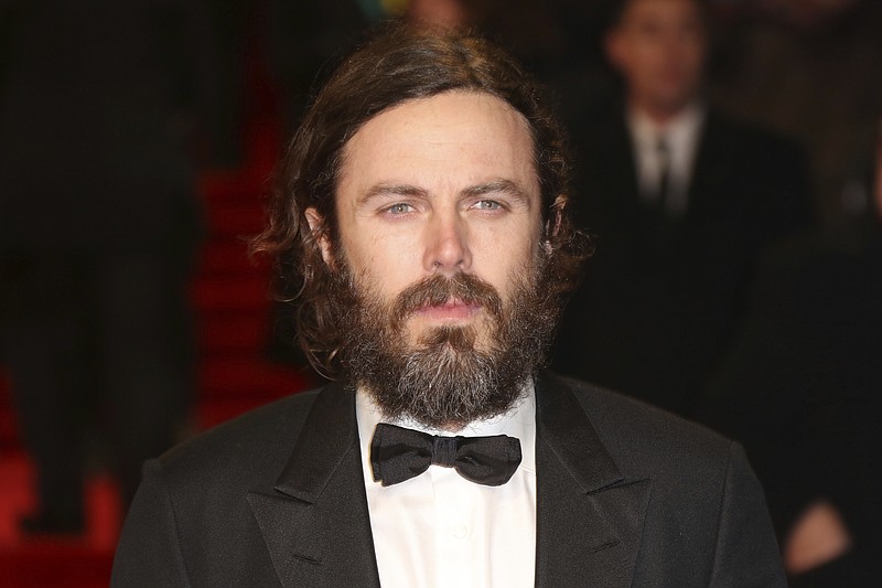 
              Actor Casey Affleck poses for photographers upon arrival at the British Academy Film Awards in London, Sunday, Feb. 12, 2017. (Photo by Joel Ryan/Invision/AP)
            