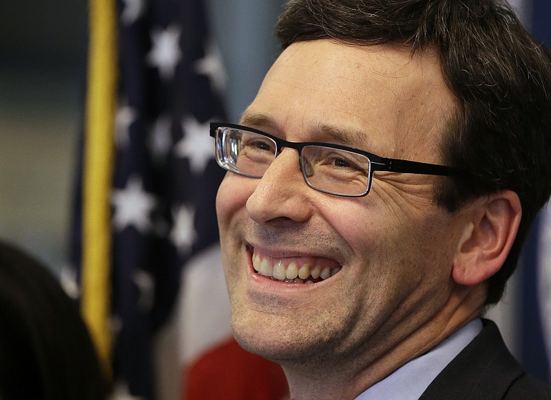 
              Washington Attorney General Bob Ferguson smiles at a news conference about a federal appeals court's refusal to reinstate President Donald Trump's ban on travelers from seven predominantly Muslim nations, Thursday, Feb. 9, 2017, in Seattle. The ruling dealt another legal setback to the new administration's immigration policy. In a unanimous decision, the panel of three judges from the San Francisco-based 9th U.S. Circuit Court of Appeals declined to block a lower-court ruling that suspended the ban and allowed previously barred travelers to enter the U.S. An appeal to the U.S. Supreme Court is possible. (AP Photo/Elaine Thompson)
            